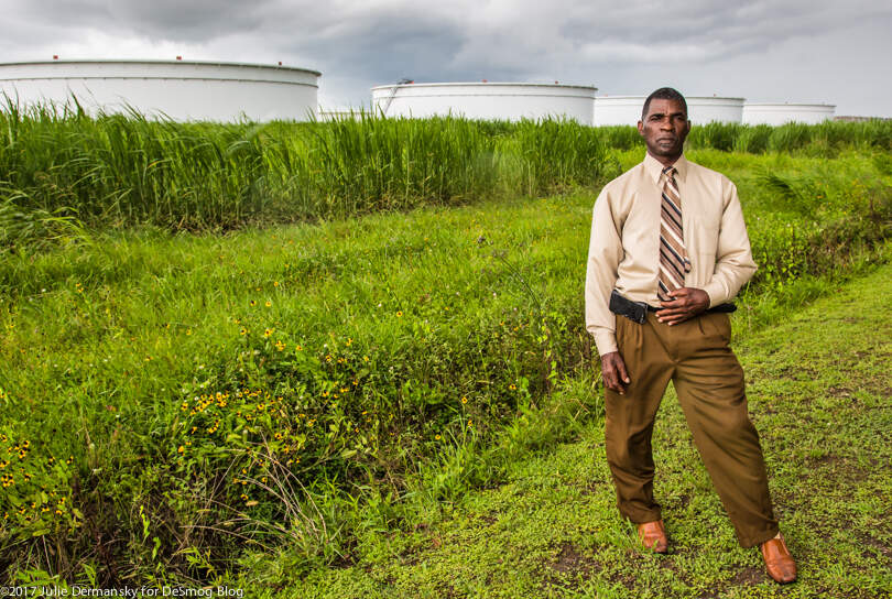 Pastor Harry Joseph near oil storage tanks in St. James, Louisiana