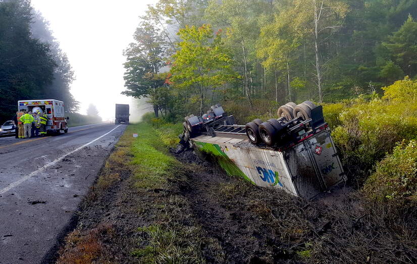 First responders at the scene where an Xpress Natural Gas truck carrying compressed natural gas rolled over in Hartwick, New York, on September 12, 2017. 