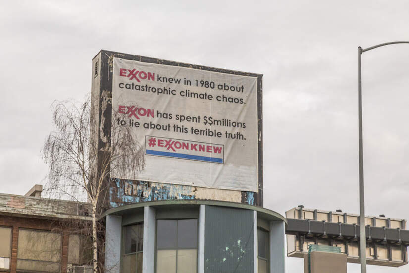 ExxonKnew banner on a billboard