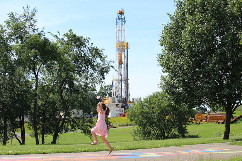 Summit Elementary School playground in Butler County, Pennsylvania, with a fracking well in the background. Credit: Moms Clean Air Force, CC BY-NC-SA 2.0