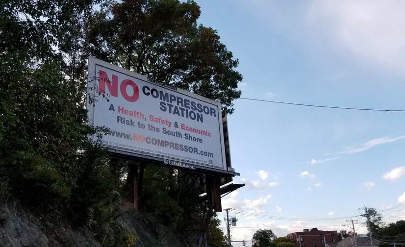 A billboard opposing the Weymouth natural gas compressor station