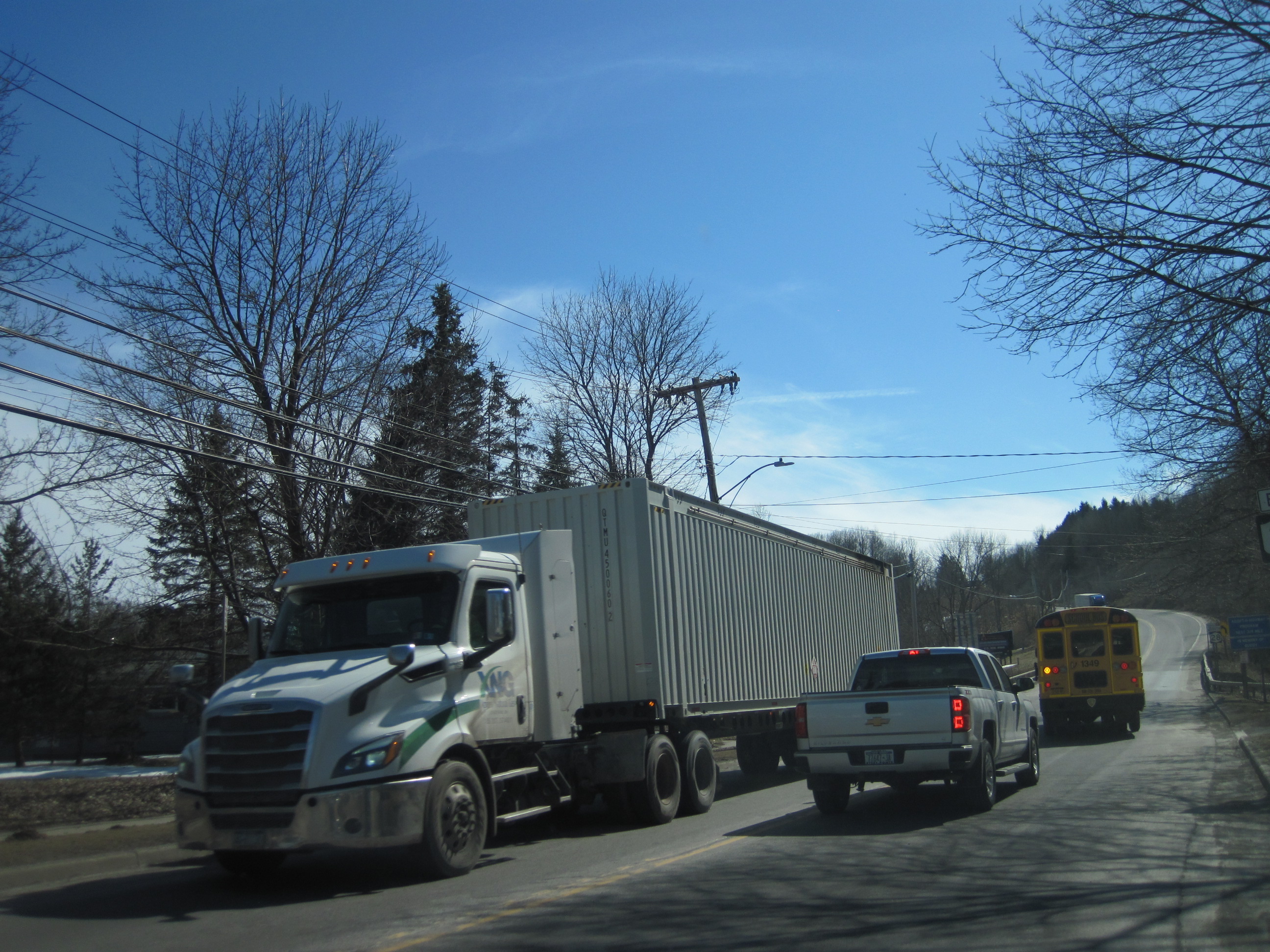 XNG truck and school bus in New York