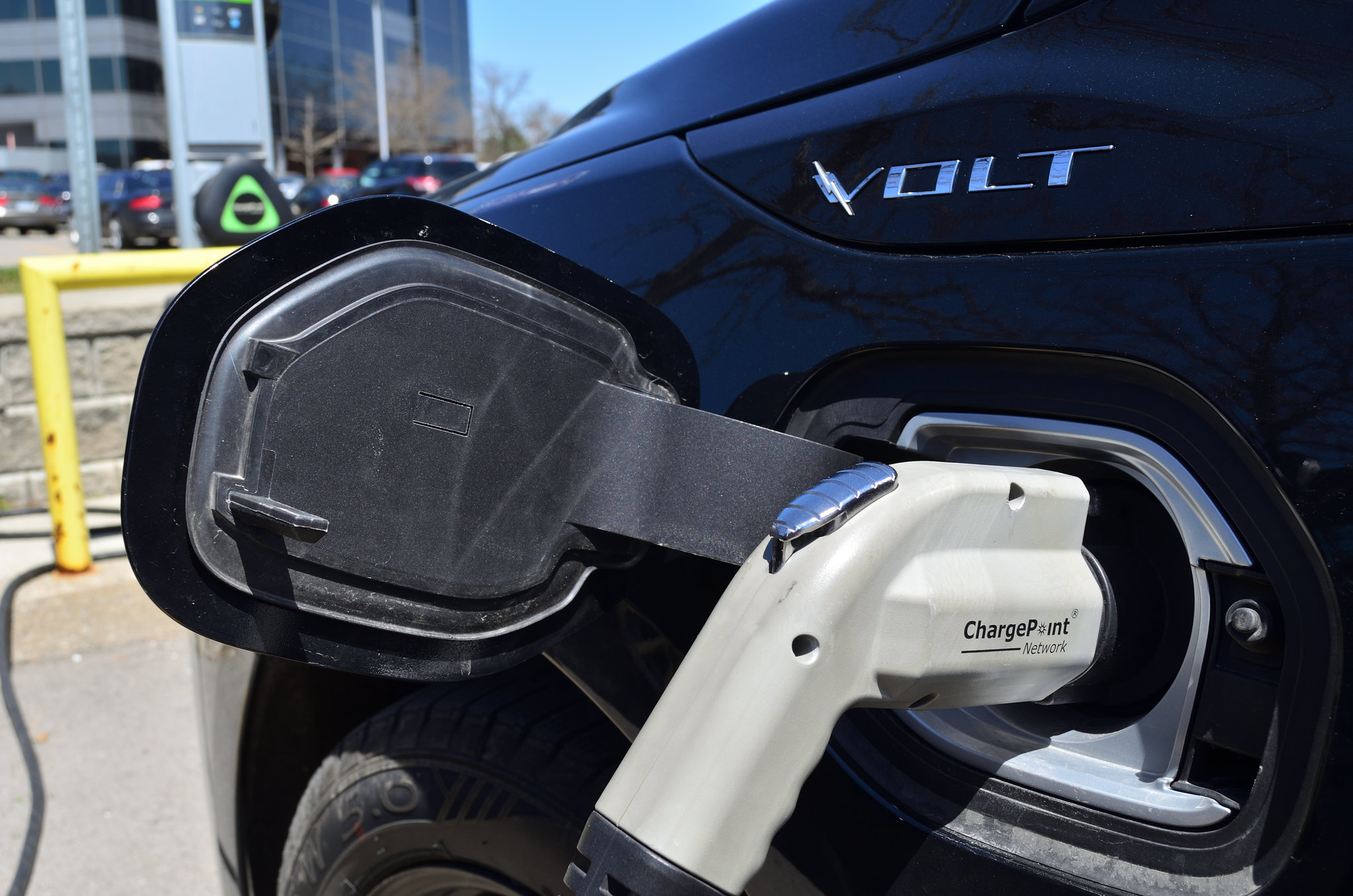 Close up view of a Volt electric car being charged 