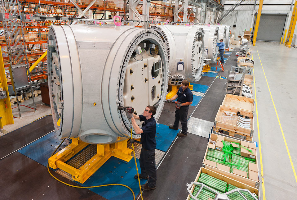 Workers in a wind turbine parts manufacturing facility in Arkansas.