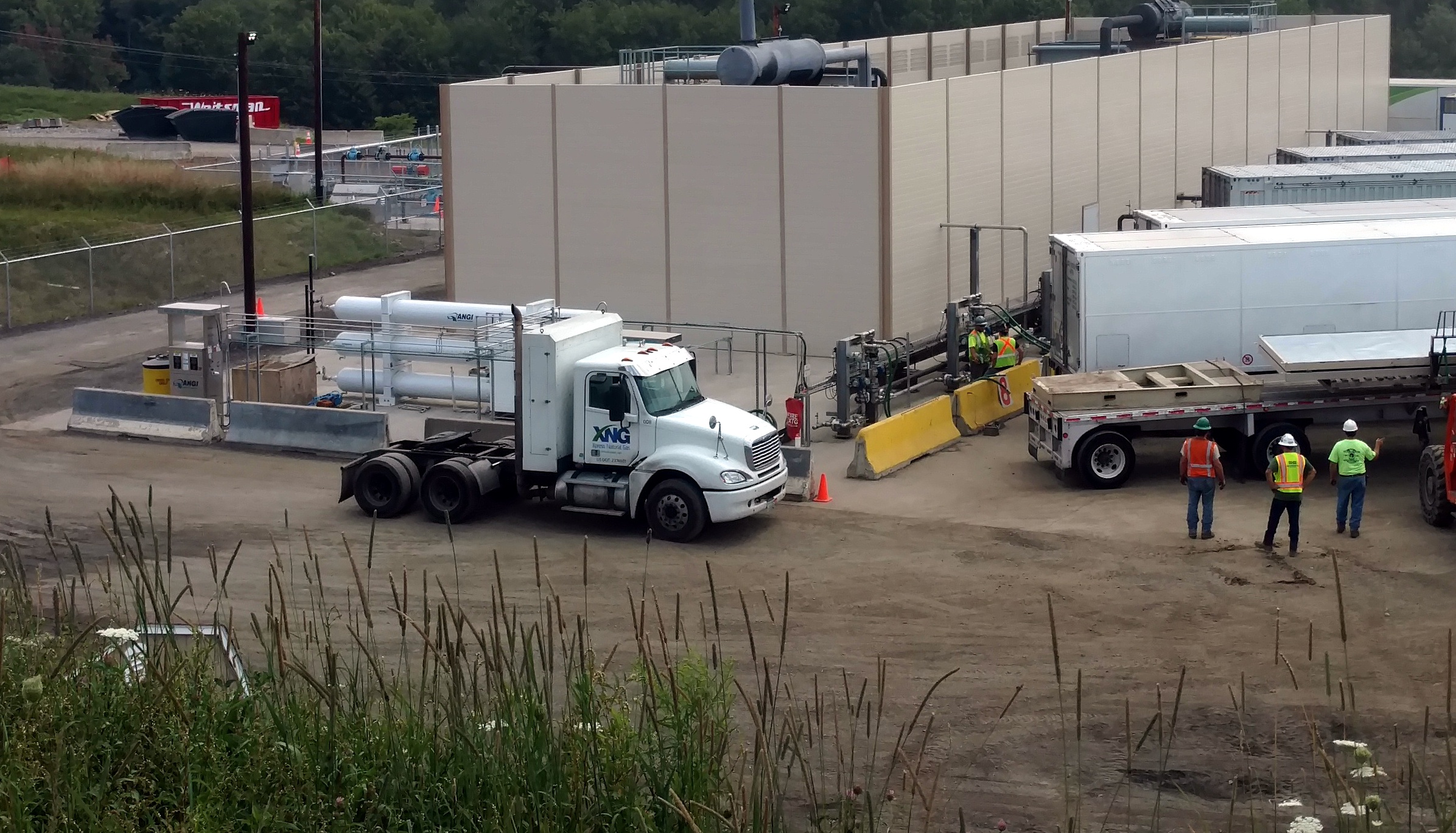 Xpress Natural Gas trucks filling up with compressed natural gas at a facility in Forest Lake, Pennsylvania.
